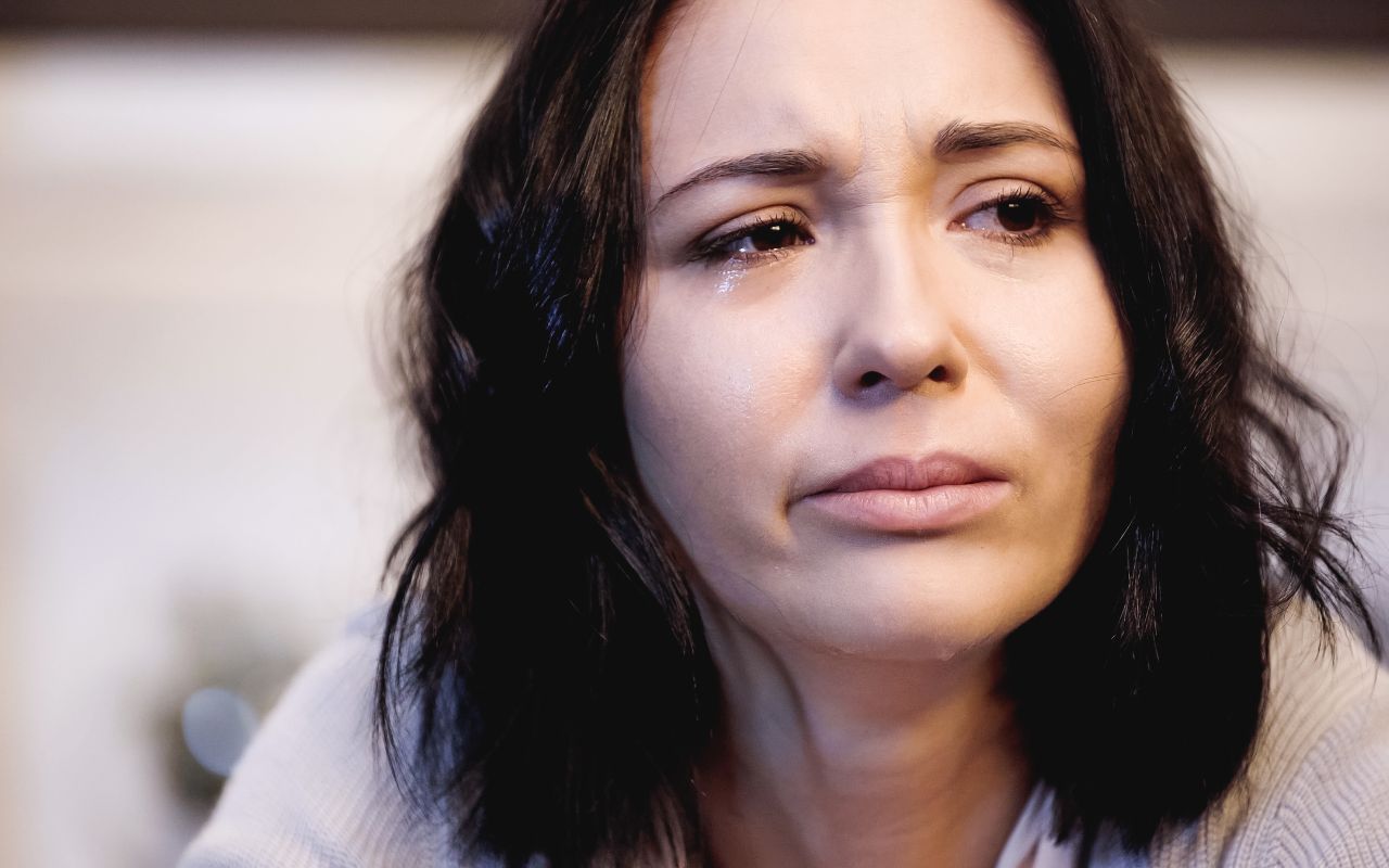 close up of a woman crying