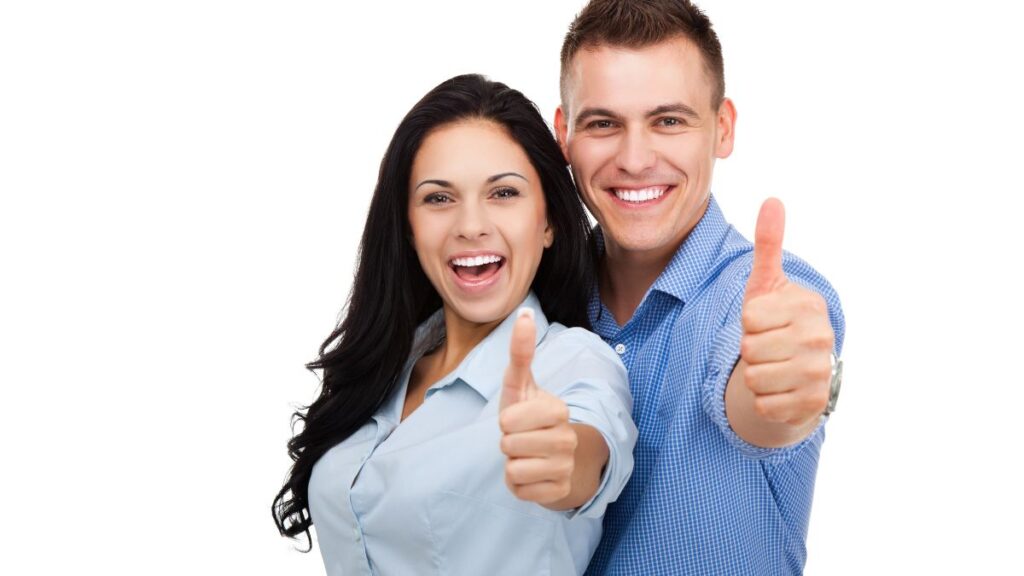 Complimenting Women: man and woman standing together smiling with a thumbs up.