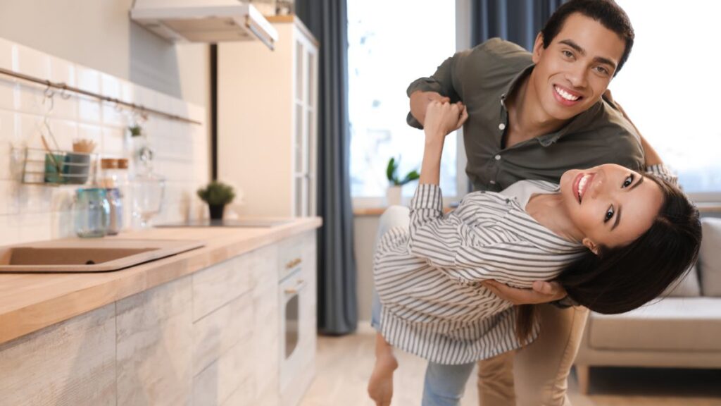 couple dancing in their kitchen