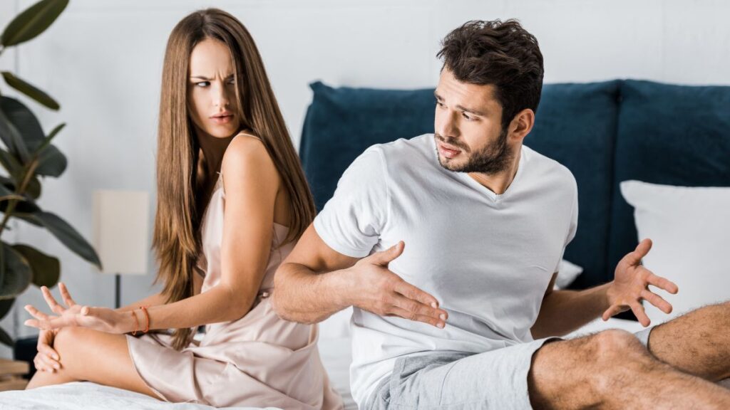 couple fighting on the bed