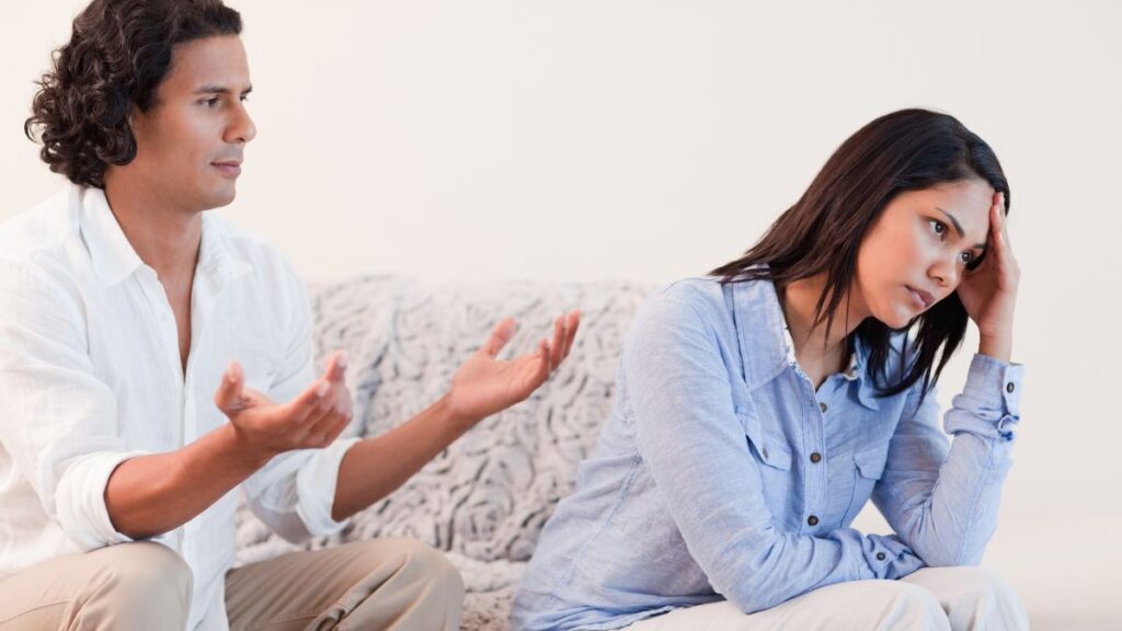 couple fighting on the couch woman looking away