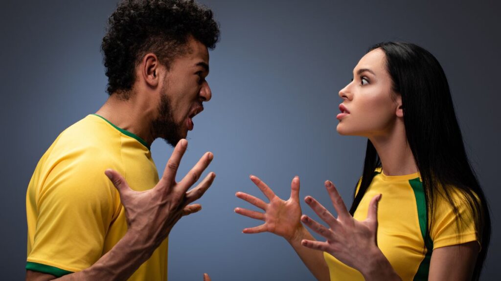 couple fighting with hands up