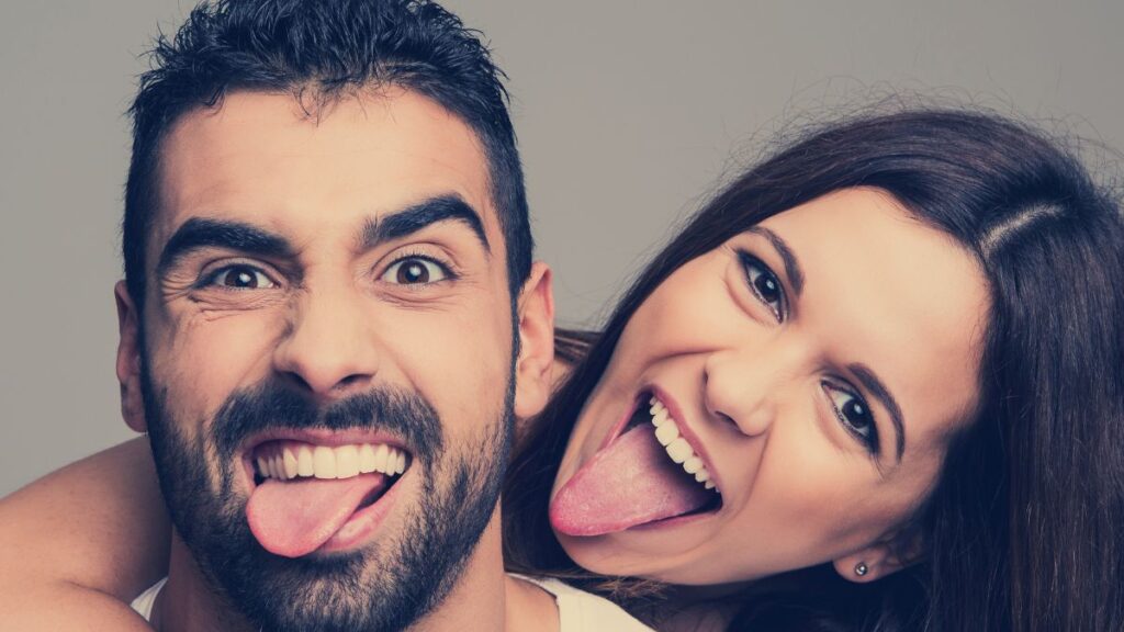 couple happy sticking out their tongues