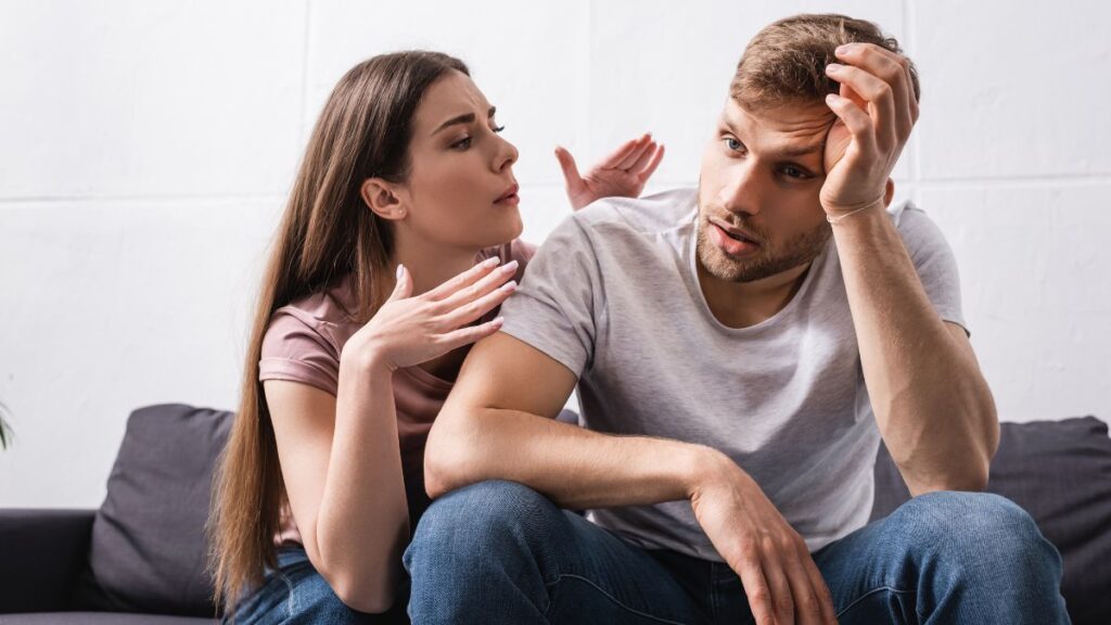 couple in disagreement on the couch