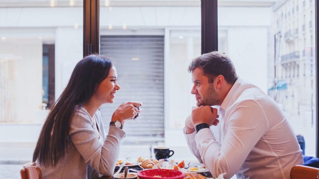 couple on a first date having coffee and dessert