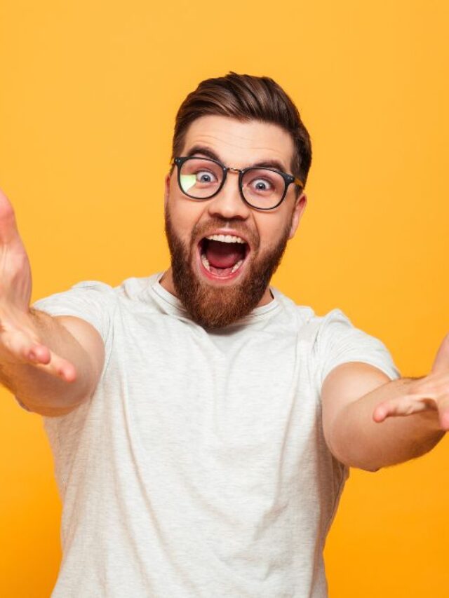 Excited man with glasses reaching his arms to you