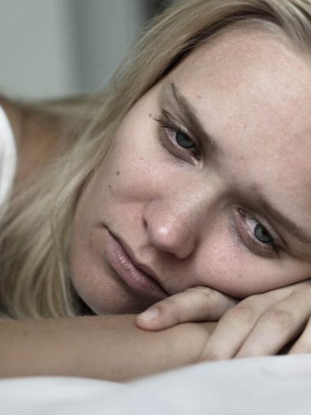 woman crying with head down