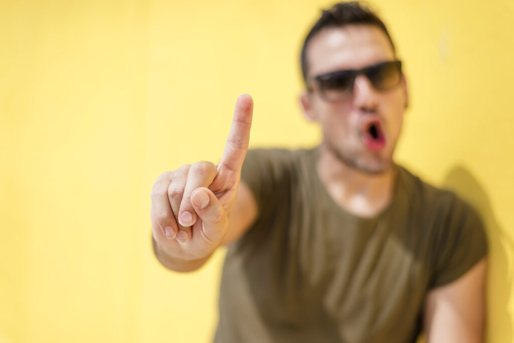 Front view of a defocus cool man saying no with sunglasses