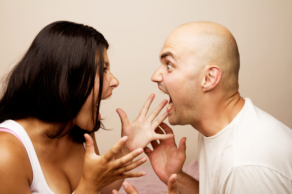 man and woman arguing in each other's face