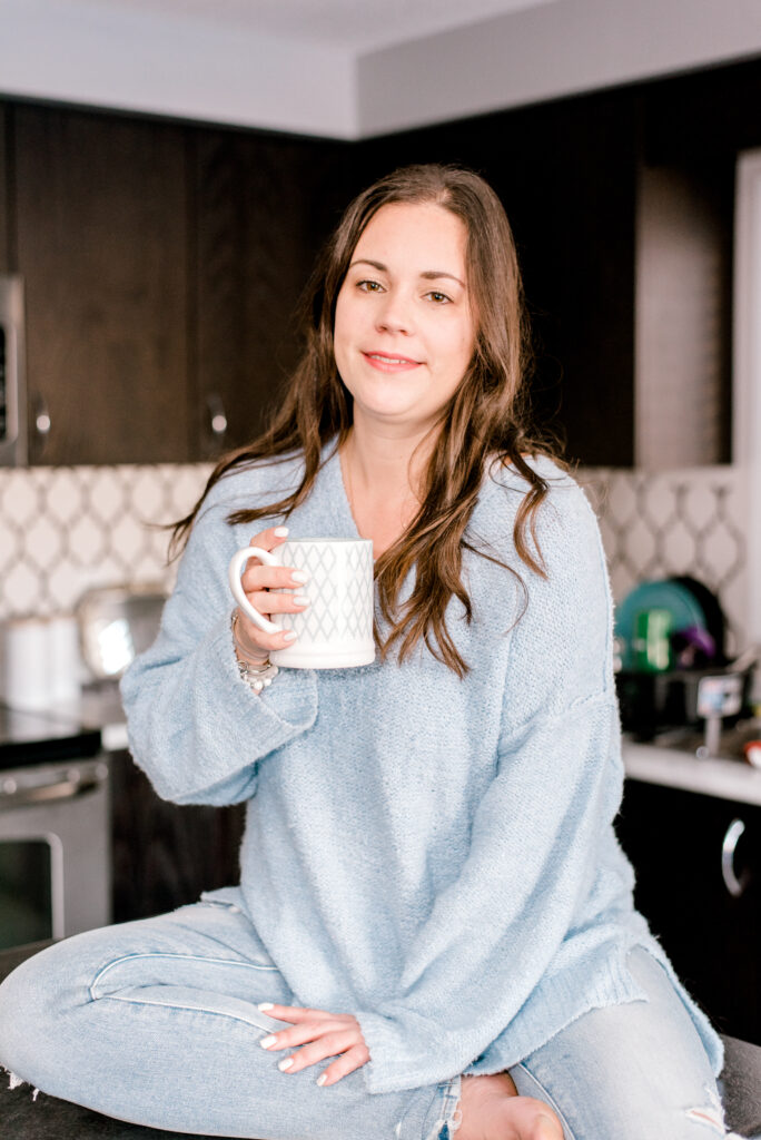 Victoria Cornell sitting on an island with coffee