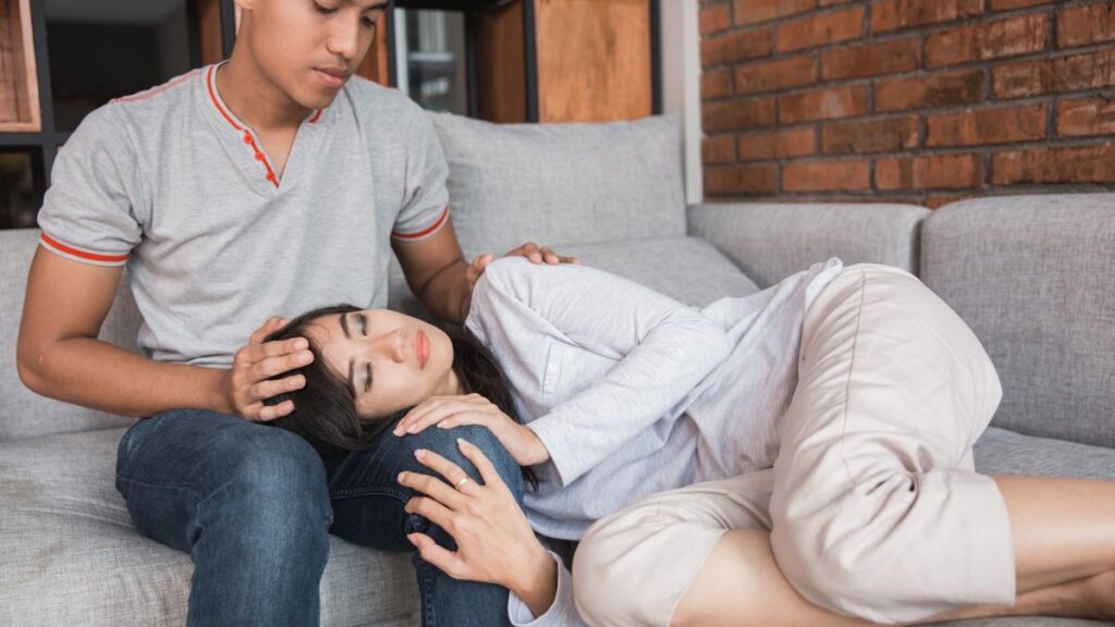 Empathy woman laying on mans lap happily