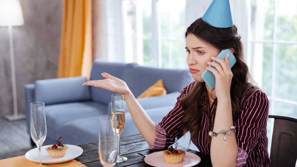 Woman sitting alone at birthday tabel