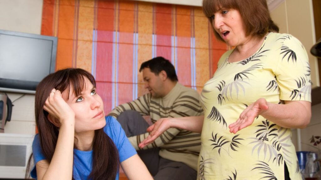 Mother in law yelling at daughter in law husband in back