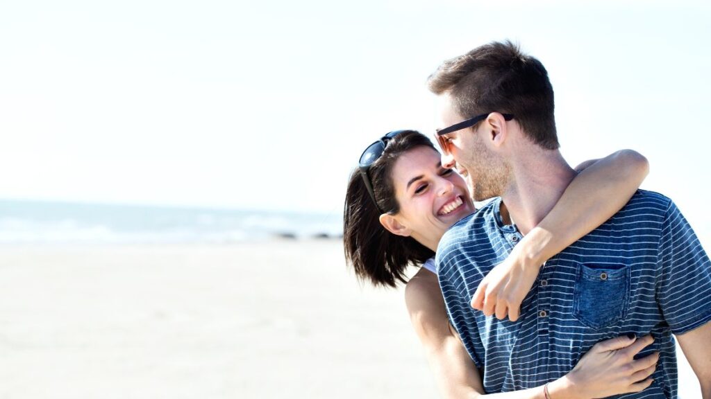 Gentle Hug couple hugging on the beach