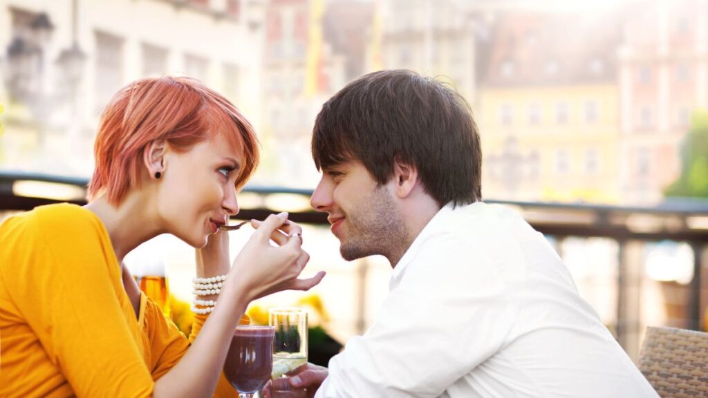 Happy couple flirting at dinner