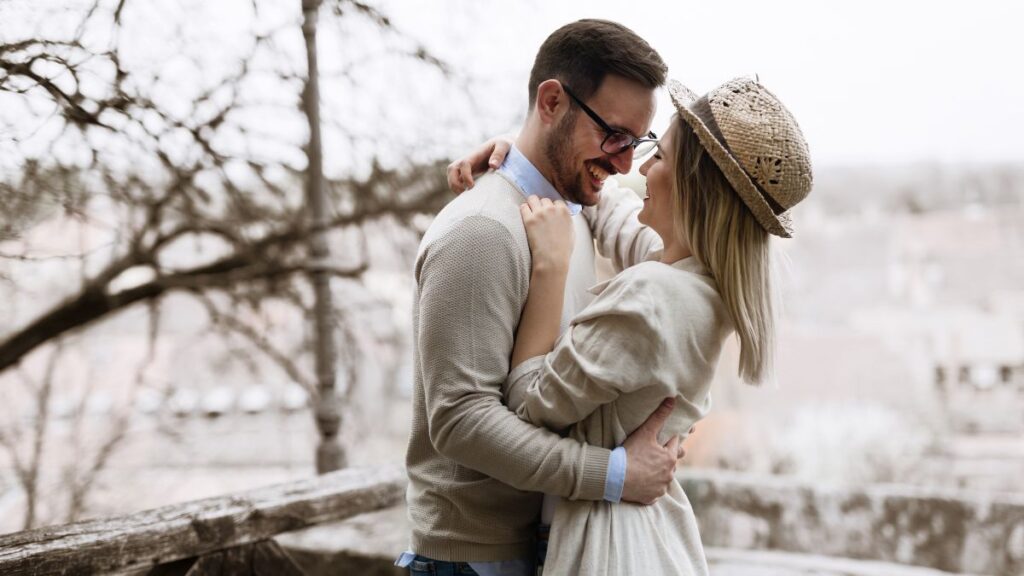 happy couple hugging outside