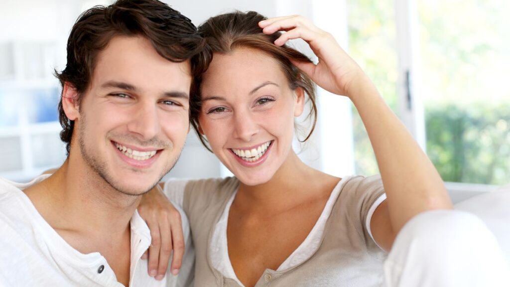 happy couple sitting and smiling together