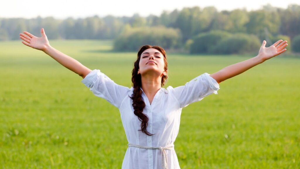 Independence woman standing with open arms