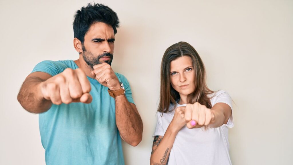 Man and Woman punching the air