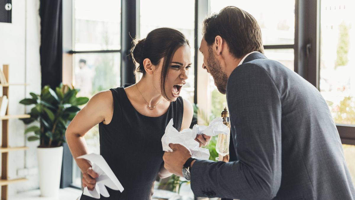 man and woman yelling over a table