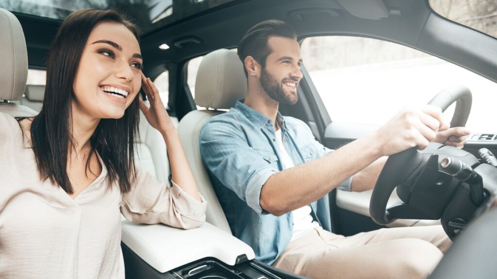 Man and woman. Man is driving the car.