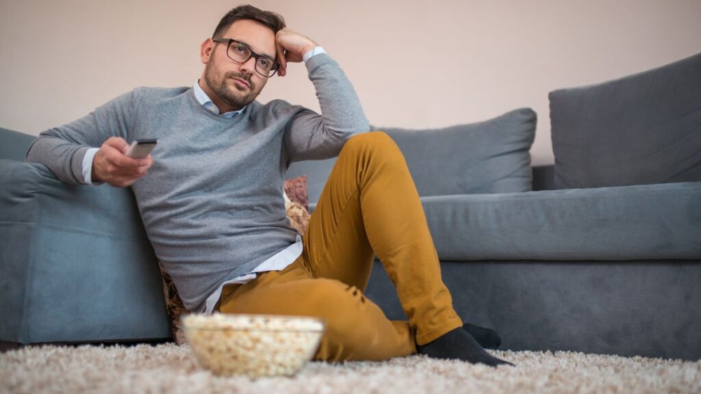 man sitting and watching tv