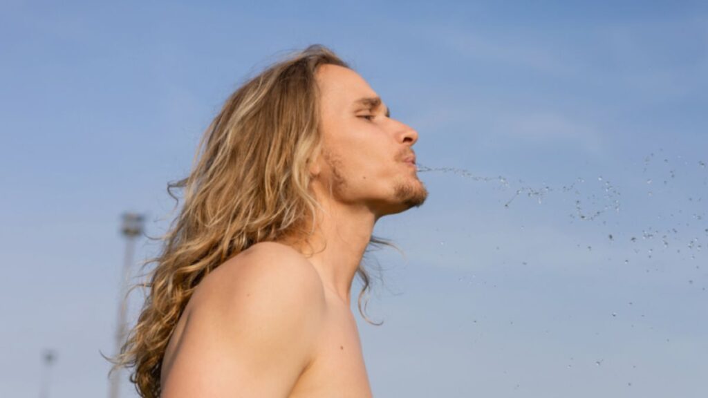 Man spitting out water 