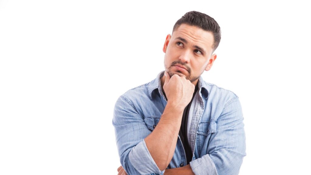 man thinking with hand on chin looking to the side