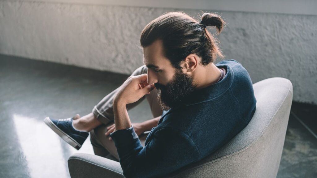 Man with a man bun and beard