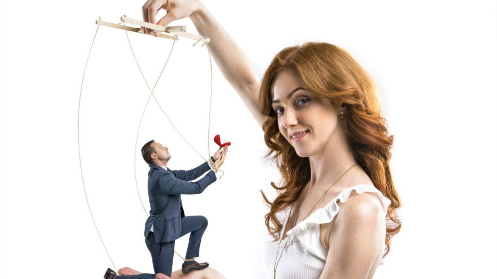 Manipulation woman with man on puppet strings proposing