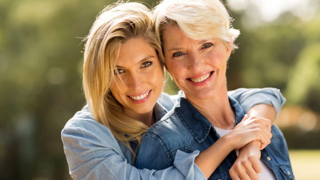 mom and daughter smiling and hugging