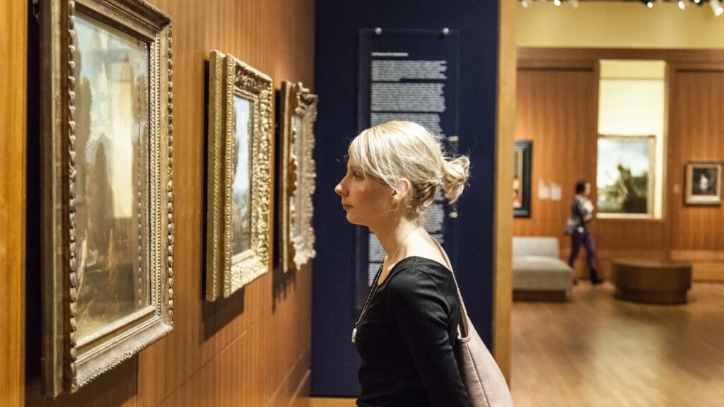 Museums woman looking at art in the museum