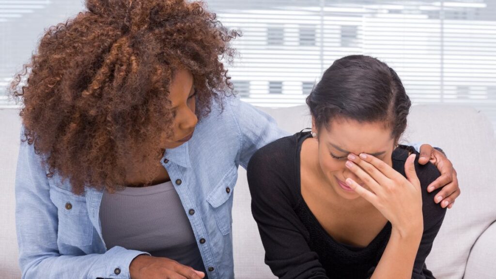 Woman crying with therapist