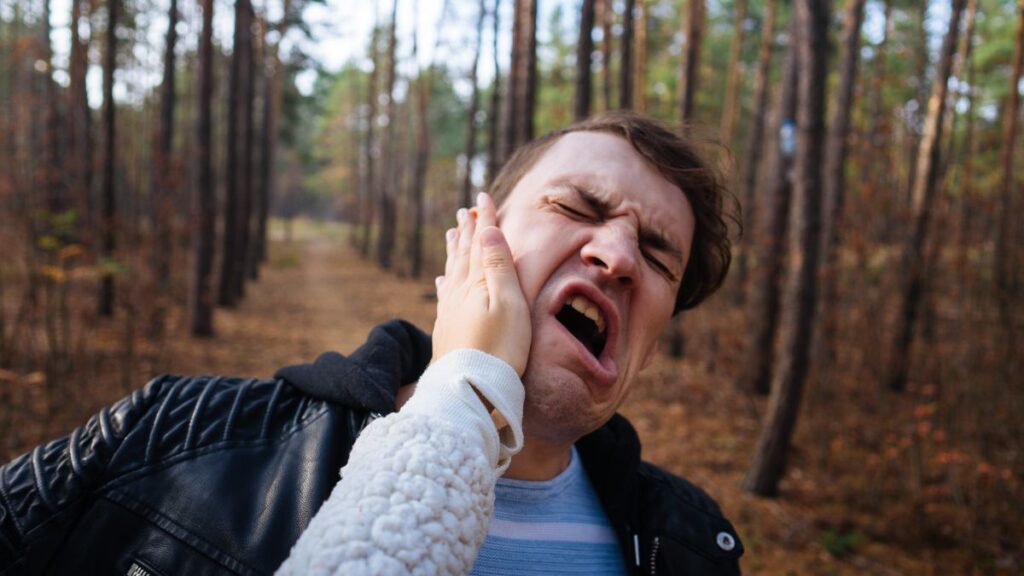 Slapped In The Face: woman’s hand smacking a man in the face.