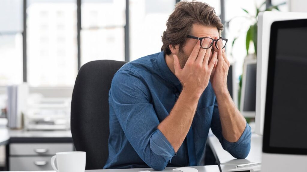 stressed out man at computer