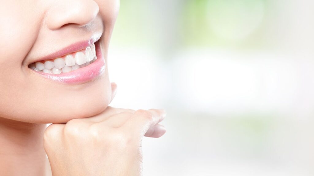 Teeth whitening or other dental treatments woman smiling with white teeth
