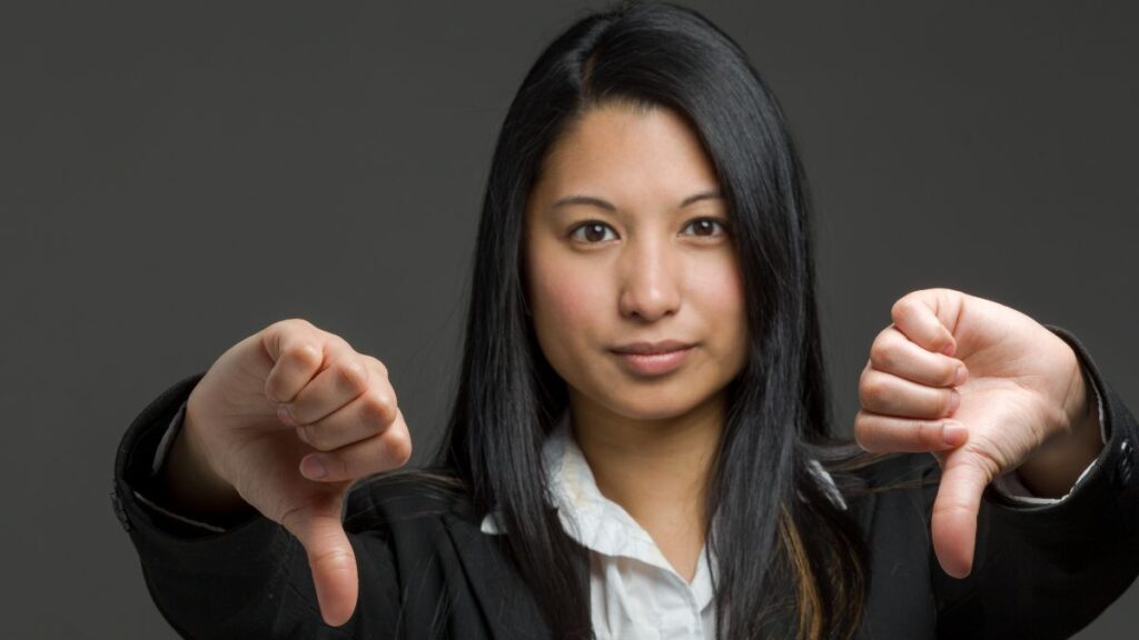 Touching woman showing thumbs down