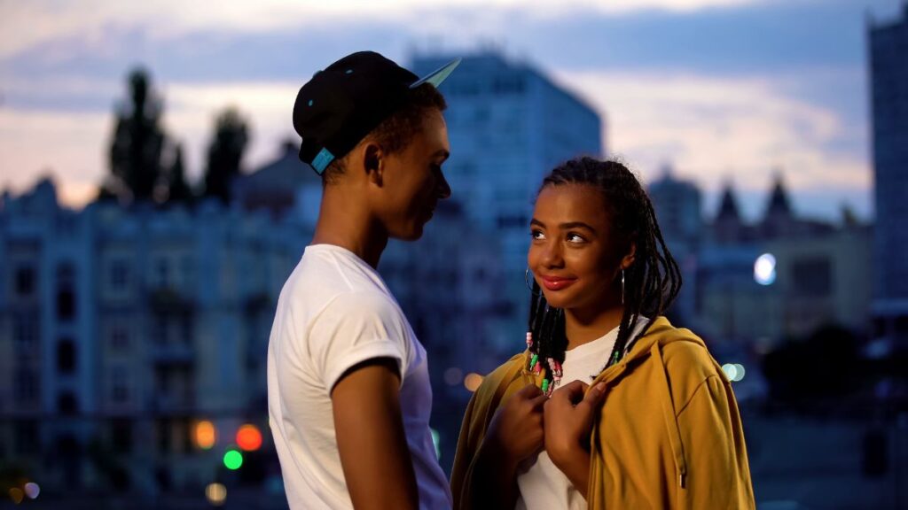 Truth Teller couple standing outside smiling at each other