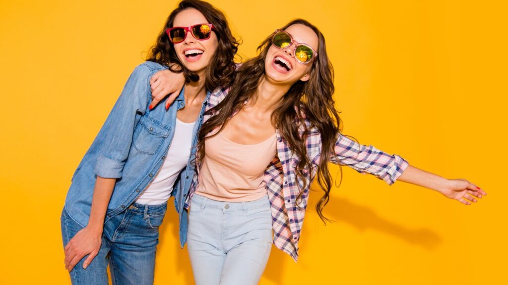 two women hugging and laughing