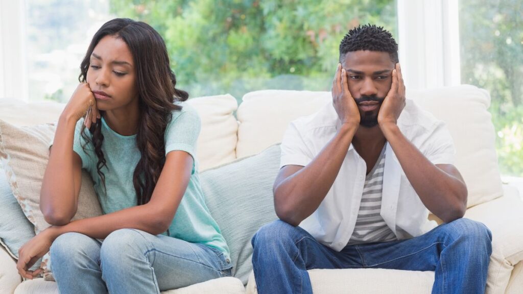 Vacillating Personalities couple sitting upset on the couch