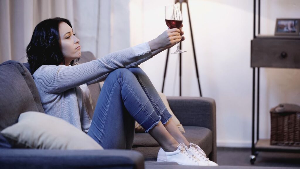 Woman alone with a glass of wine