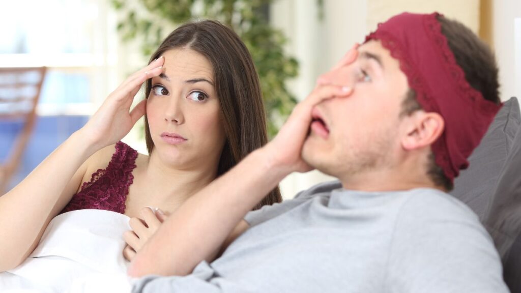 Woman and man in bed filled with regret