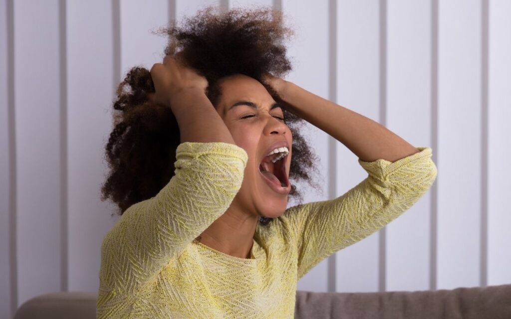 Woman Angry holding her hair