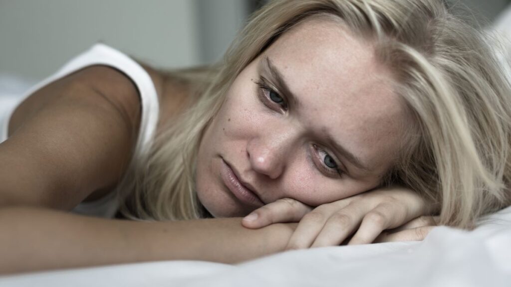 woman crying with head down