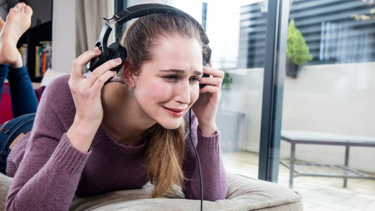 Woman Listening to Music Crying