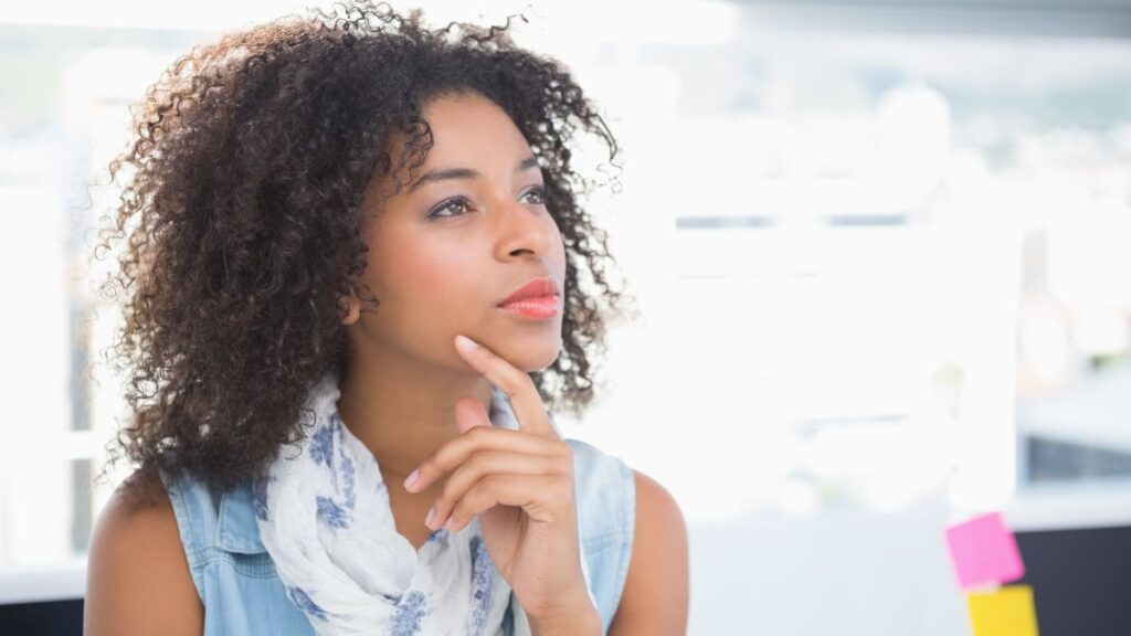 woman looking away and on chin