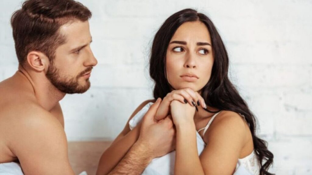 woman looking away upset from her man