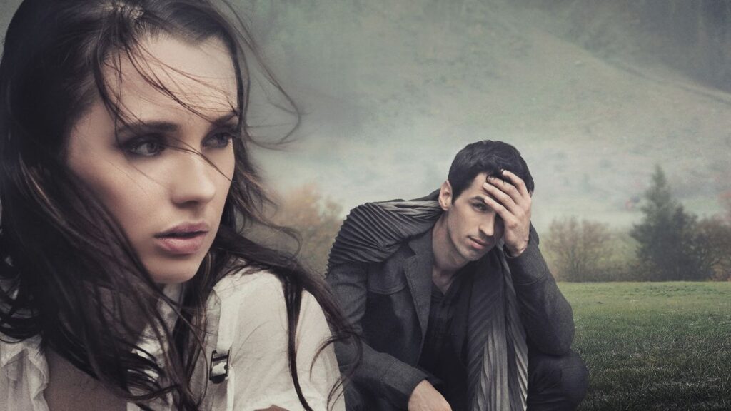 woman looking back as man looks at her with his hands on his head