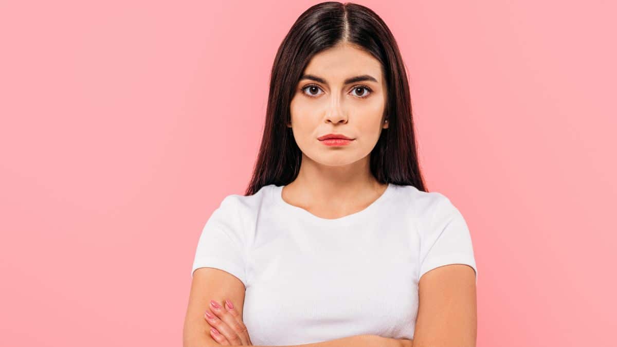 Woman looking serious crossing her arms