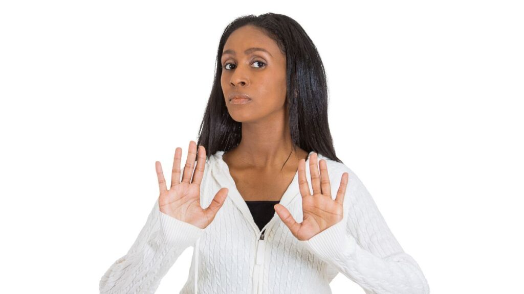 woman showing stop with hands up